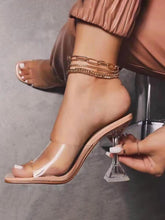 Sandalias con estampado de leopardo y tiras transparentes con tacón de cristal